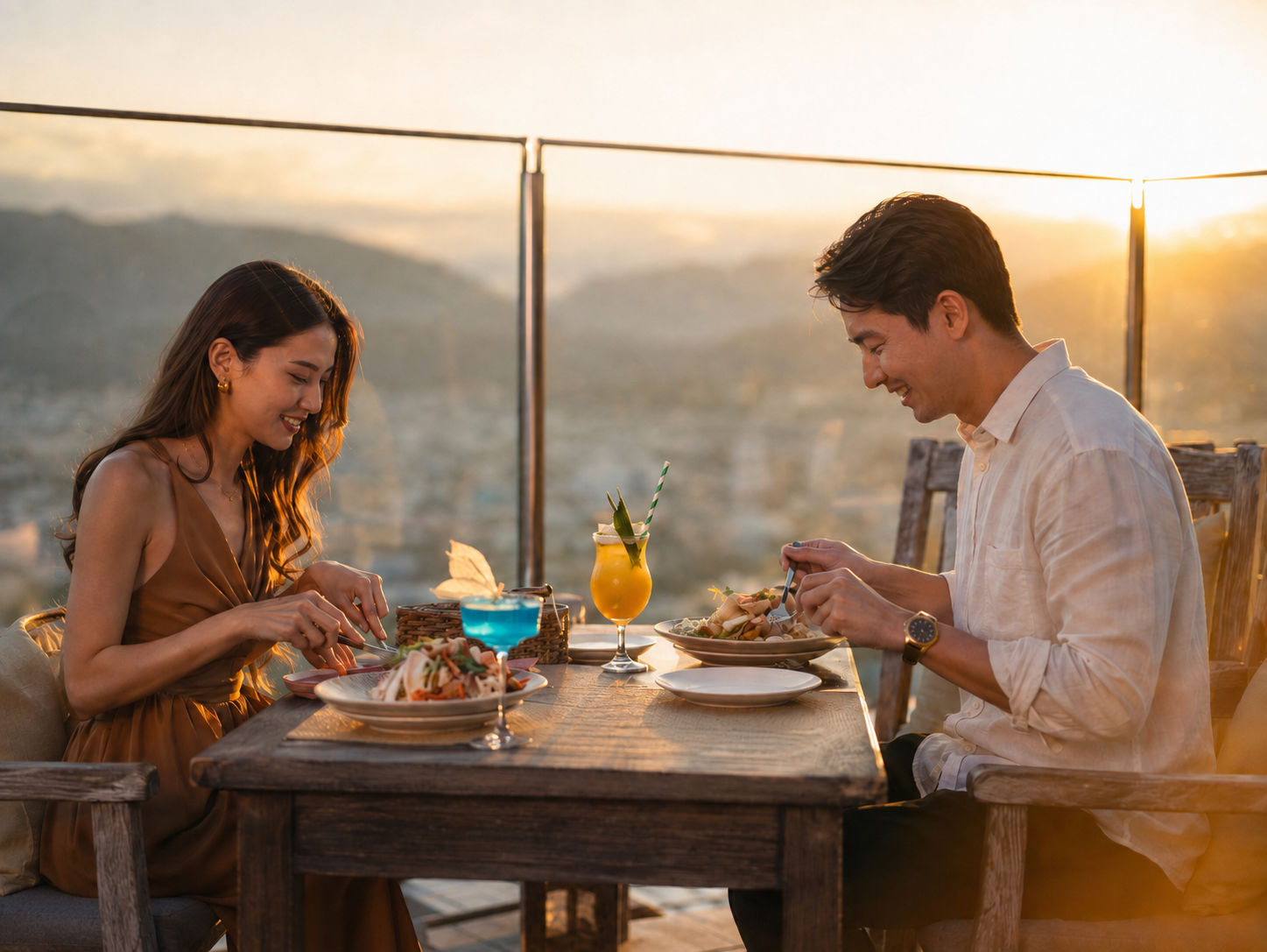 Cặp đôi dùng bữa tối bên cửa kính tại Lá Kitchen Nha Trang trong khung cảnh hoàng hôn nhìn ra thành phố
