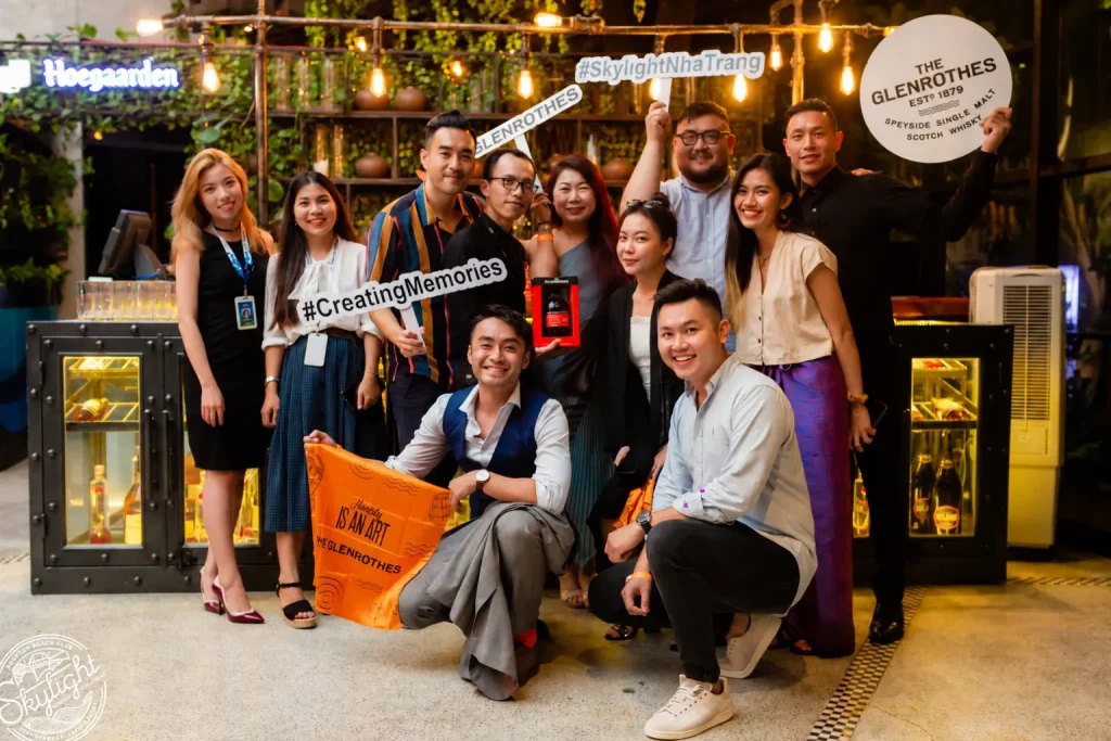 Corporate event venue Nha Trang - guests posing at the check-in area by the Skylight bar