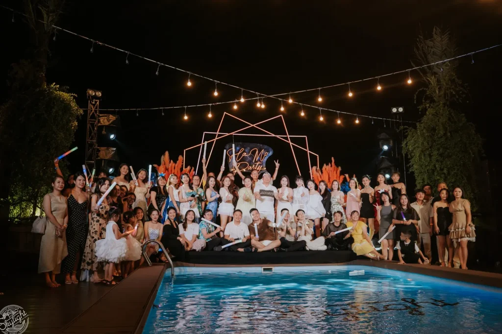 Company year-end party venue in Nha Trang - team photo by the pool at Lá Kitchen, Skylight